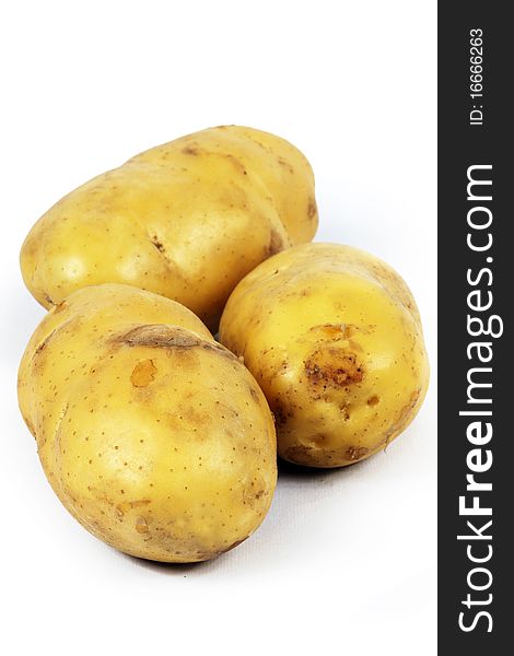 Three potatoes on white background