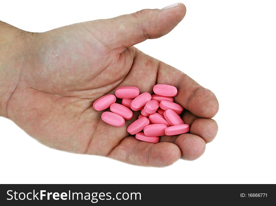 Pills in Hand on White Background