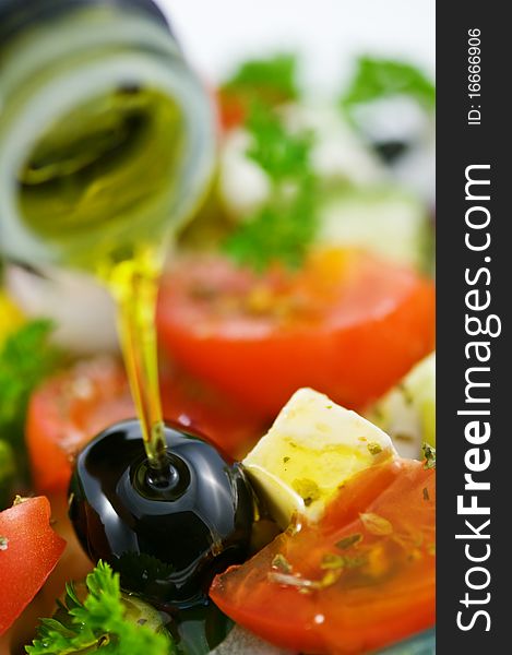 Olive oil in salad closeup