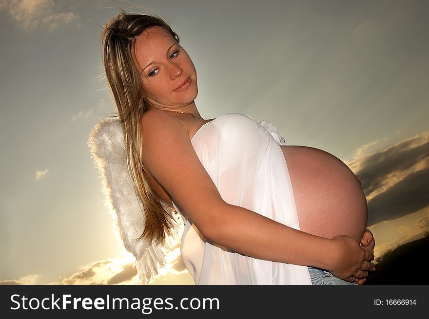 Beautiful, happy pregnant girl in nature. Beautiful, happy pregnant girl in nature