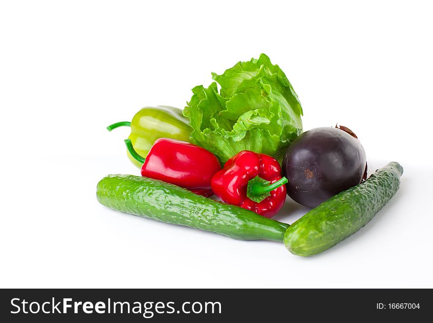 Young girl with  vegetables over white background