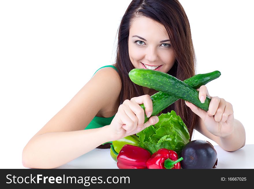 Young girl with  vegetables over white background