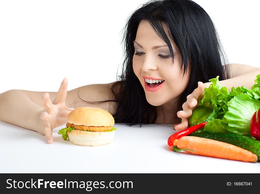 Beautiful woman with vegetables over white background. Beautiful woman with vegetables over white background