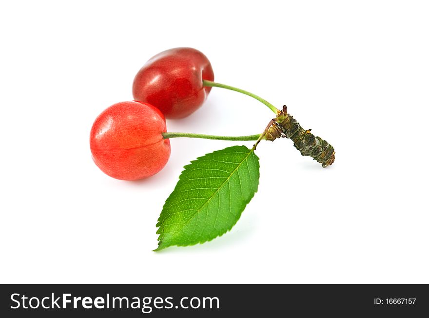 Ripe red cherry with leaf isolatedcherry