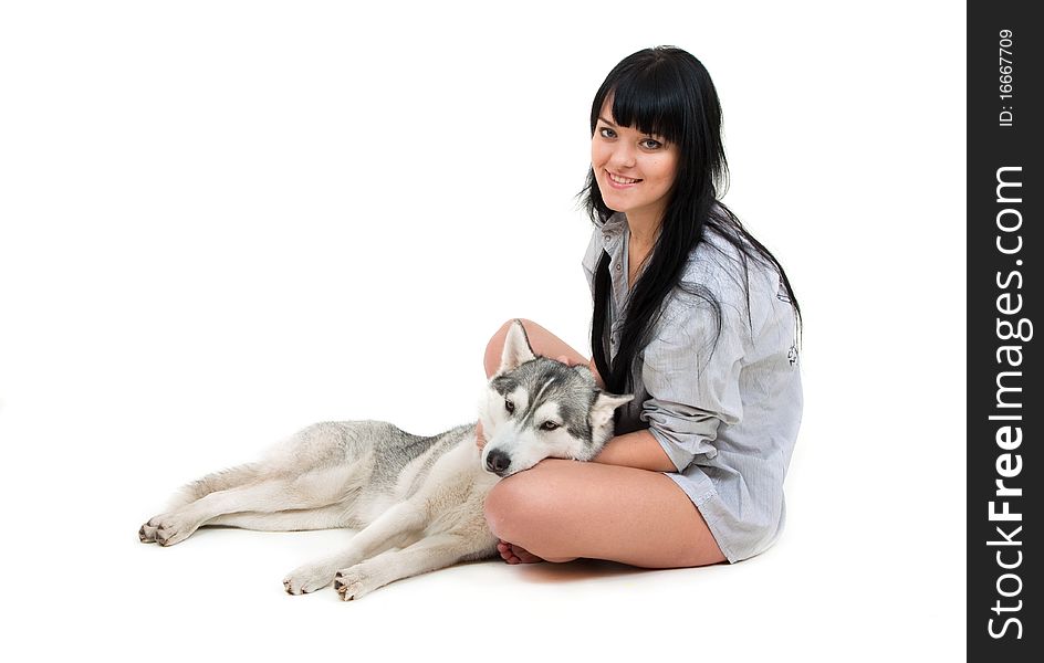 Cute girl with grey siberian husky isolated on white