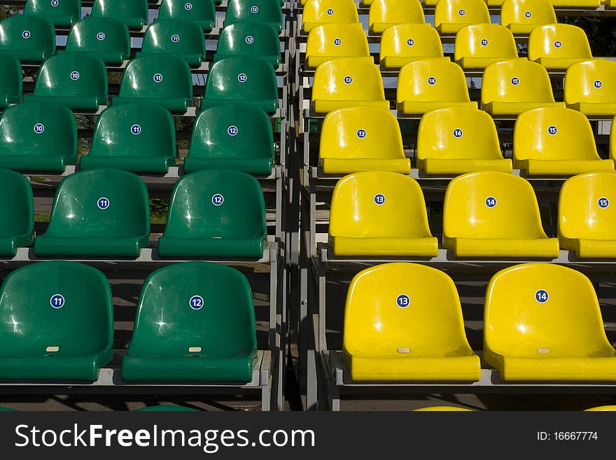 Yellow and green seats in the stadium