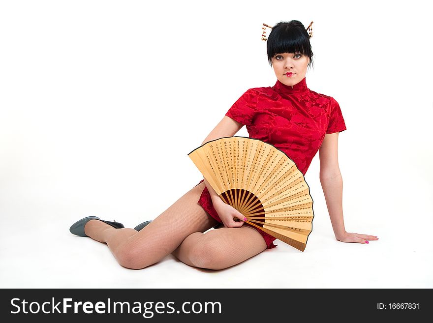 Portrait of girl in geisha with fan costume isolated on white
