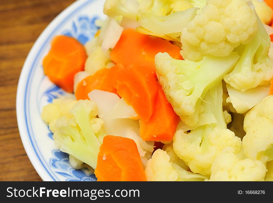 Simple white cauliflower cuisine cooked with carrots Oriental style.