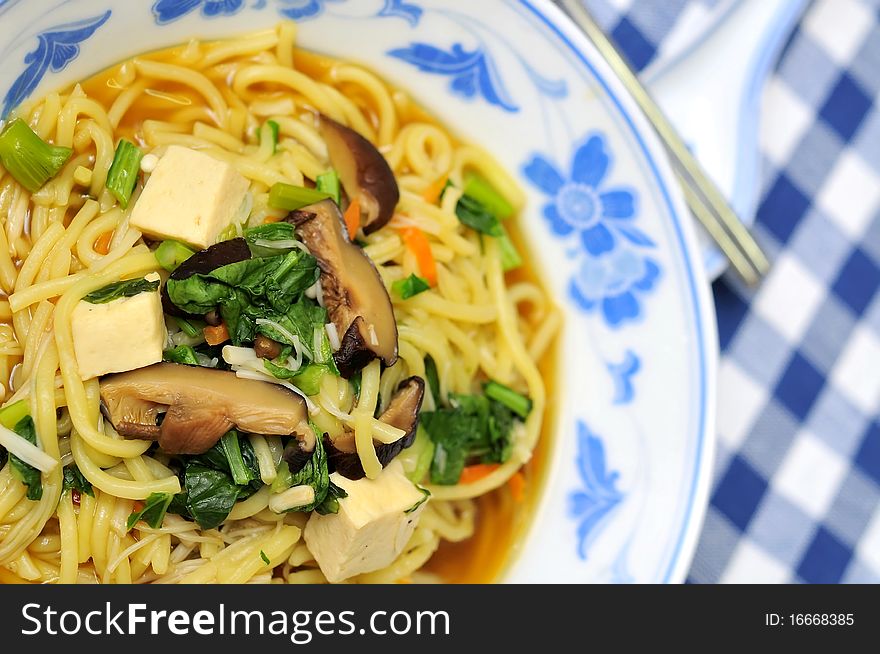 Asian noodles in restaurant cooked with nutritious ingredients.