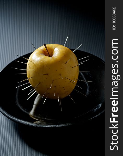 prickly apple in a dish of black ceramic