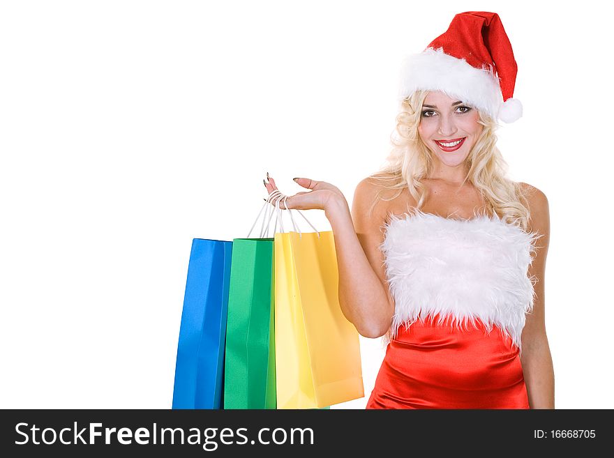 Beauty girl in santa hat with color bag over white background