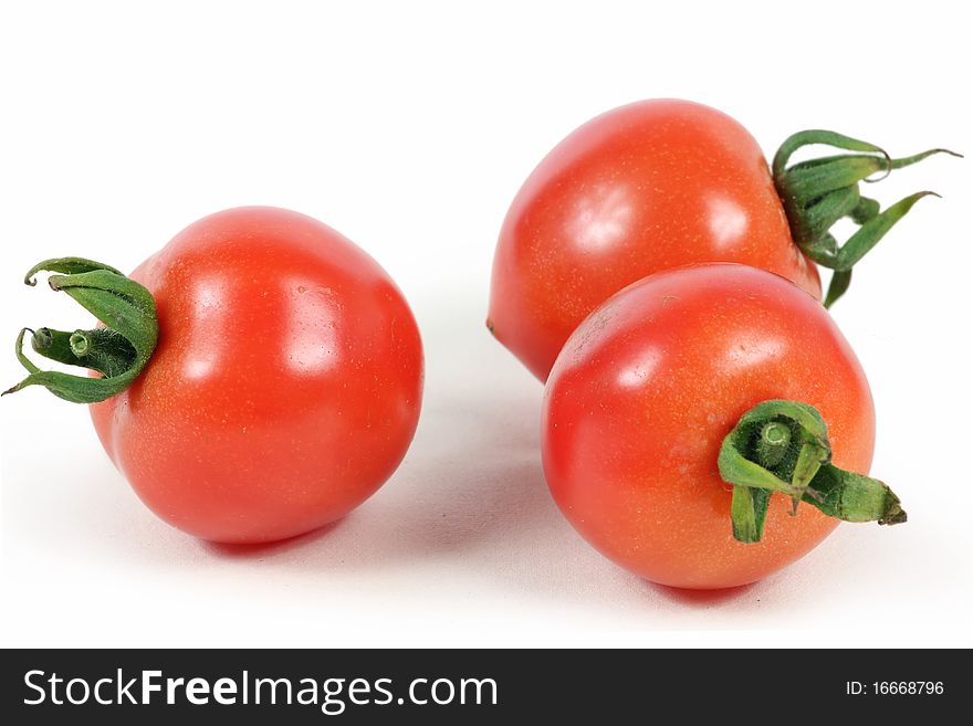 Red fresh tomato on isolated white background