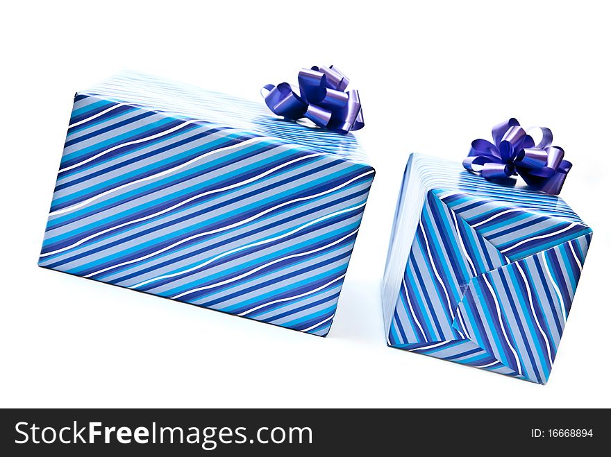 Two blue paper gifts boxes with bows. Isolated on white background. Two blue paper gifts boxes with bows. Isolated on white background