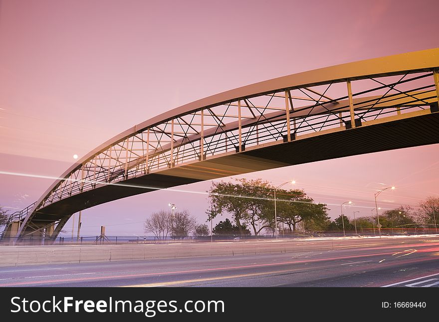 Traffic on Lake Shore Drive and the pedestrian bridge. Taken during sunset with tobacco filter.