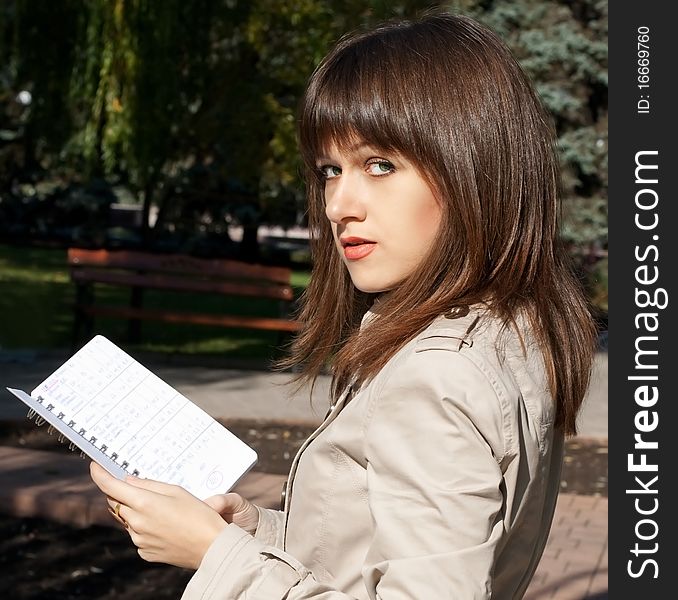 Young beauty woman with note book