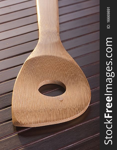 Wooden spoon - used as a tool for cooking.