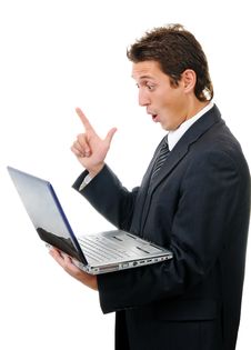 Young Businessman Reading Message On Laptop Stock Photography Young Businessman Reading Message On Laptop Stock Photography