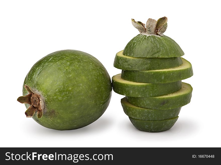 Close-up image of feijoa fruits, one whole and one cut in slices, isolated on white background. Close-up image of feijoa fruits, one whole and one cut in slices, isolated on white background.