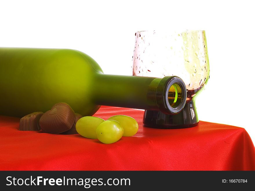 Bottle, glass, chocolate, on a red background