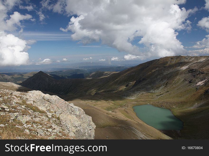 Mountain lake photographed from ridge top. Russia, Caucasus. Mountain lake photographed from ridge top. Russia, Caucasus
