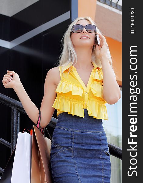 Charming young woman going shopping