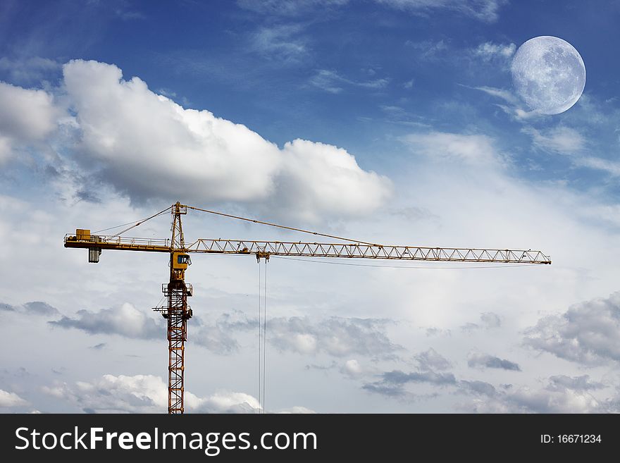 Construction crane pictured against blue sky