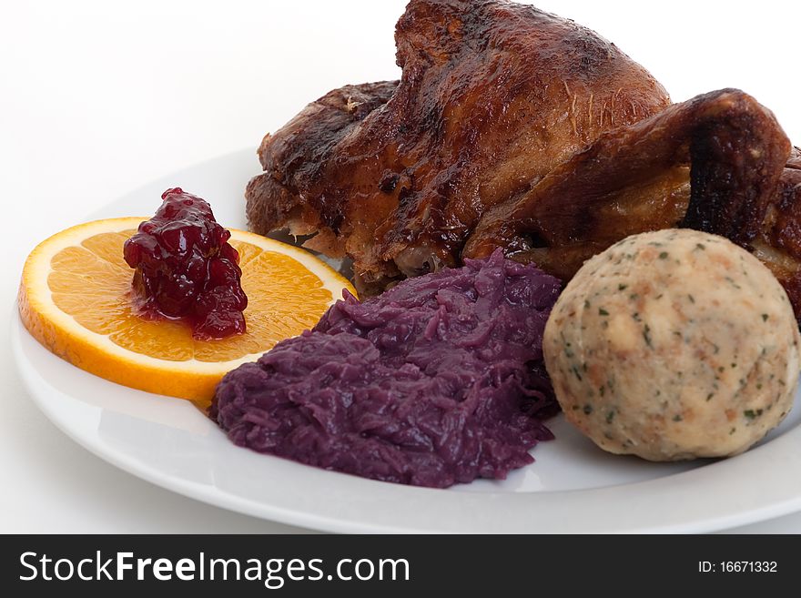 Roasted duck, festive food with dumpling and red cabbage