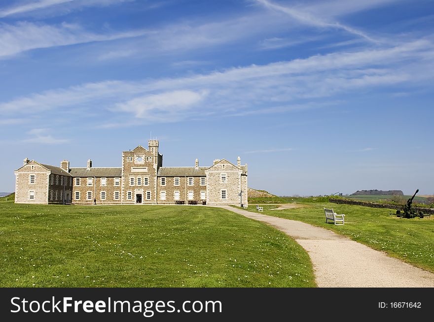 Footpath to castle under blue sky and cloud