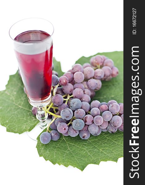 Red wine and grapes isolated in white