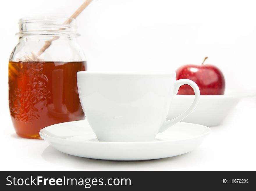 Breakfast with milk, honey and apple on the white background