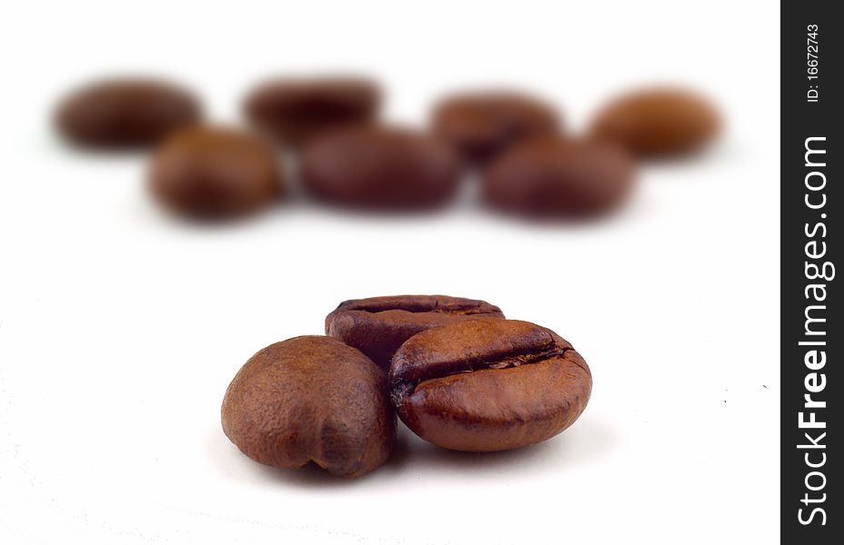 Macro of three coffee beans with blurred background. Macro of three coffee beans with blurred background