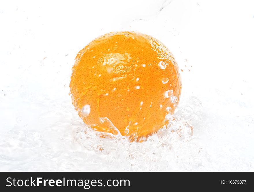 Orange in spray of pure water, isolated on white background