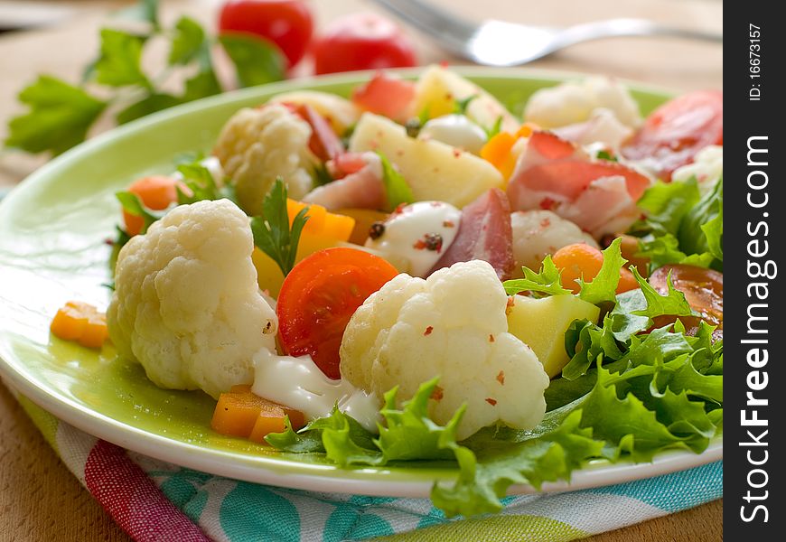 Vegetable salad with ham for dinner. Healthy and delicious!