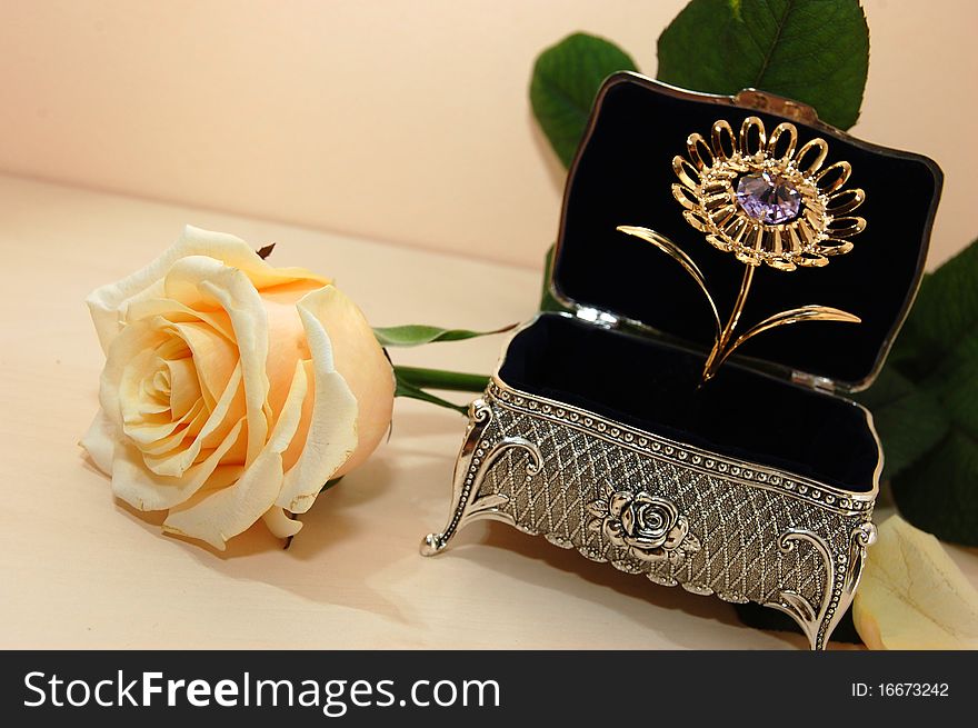 Jewelry box of bright silver with a white rose. Jewelry box of bright silver with a white rose