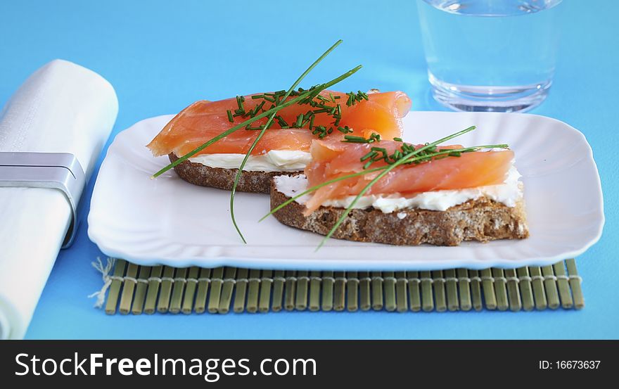 Smoked salmon on creamed cheese with chives