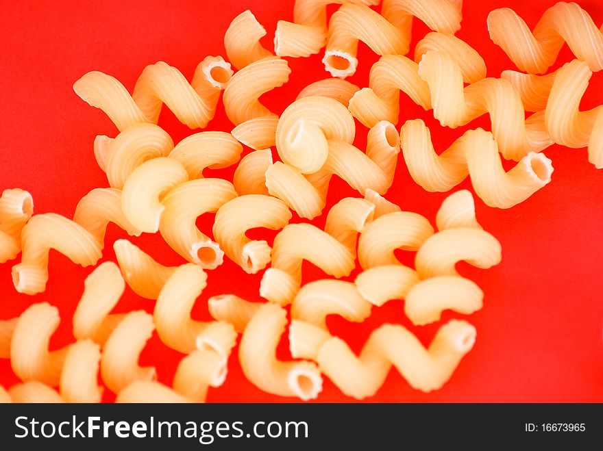 Pasta close-up on red background