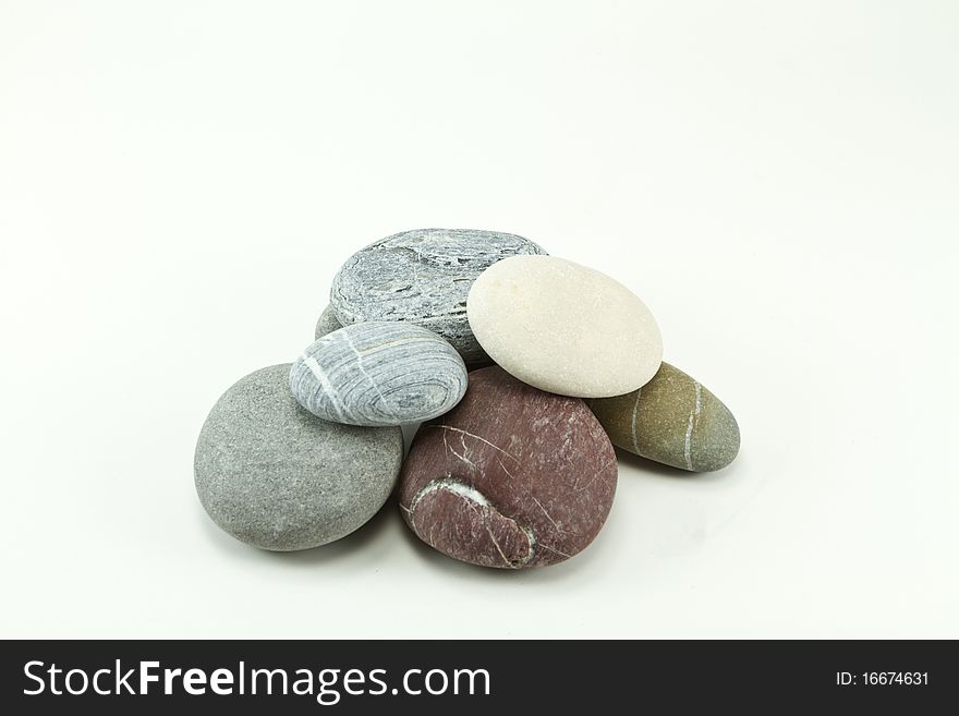 Stacked stones on a white background