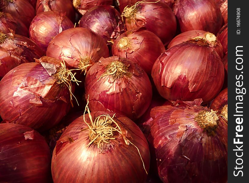 Fresh organic red onions at the market place