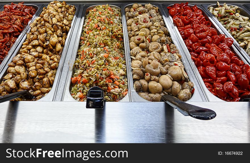 Assortment of various relishes at a deli market. Assortment of various relishes at a deli market