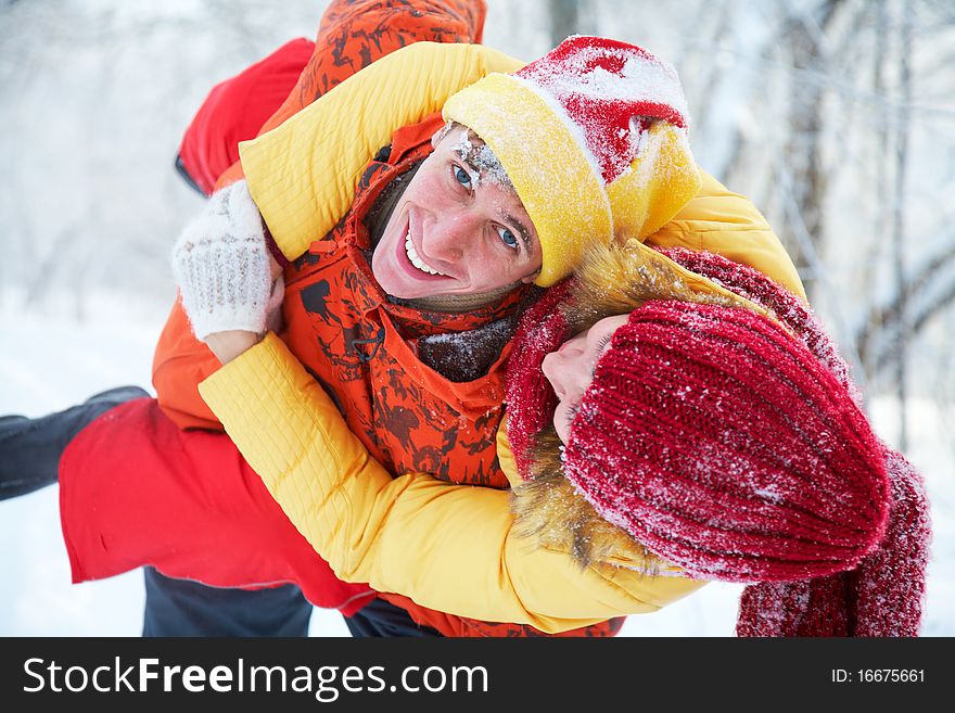 Young family plays winter wood on snow. Young family plays winter wood on snow