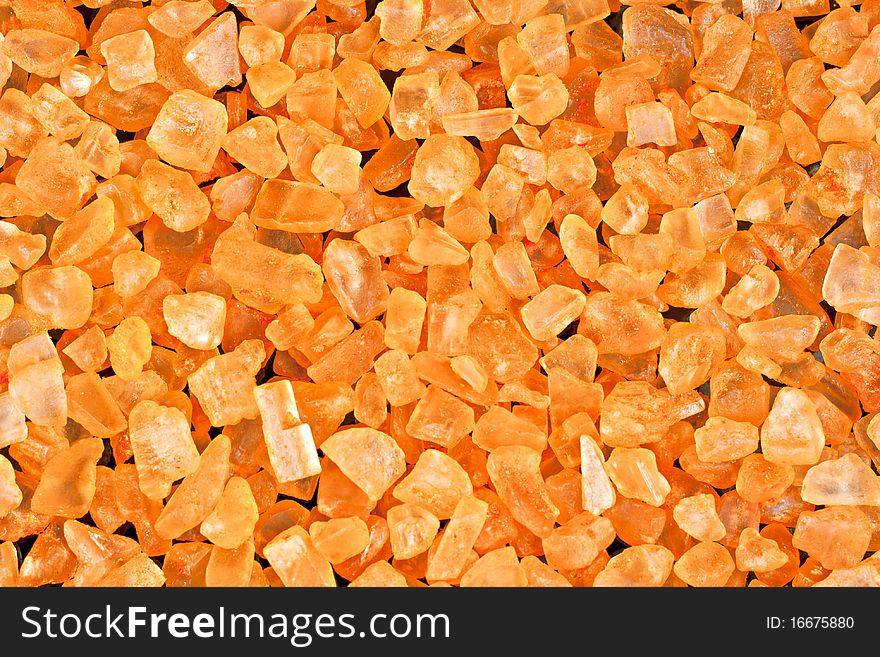 Bath salts with orange extract on a black background. Macro photography. Bath salts with orange extract on a black background. Macro photography.