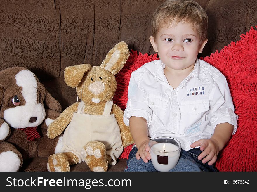 Toddler boy sitting on sofa