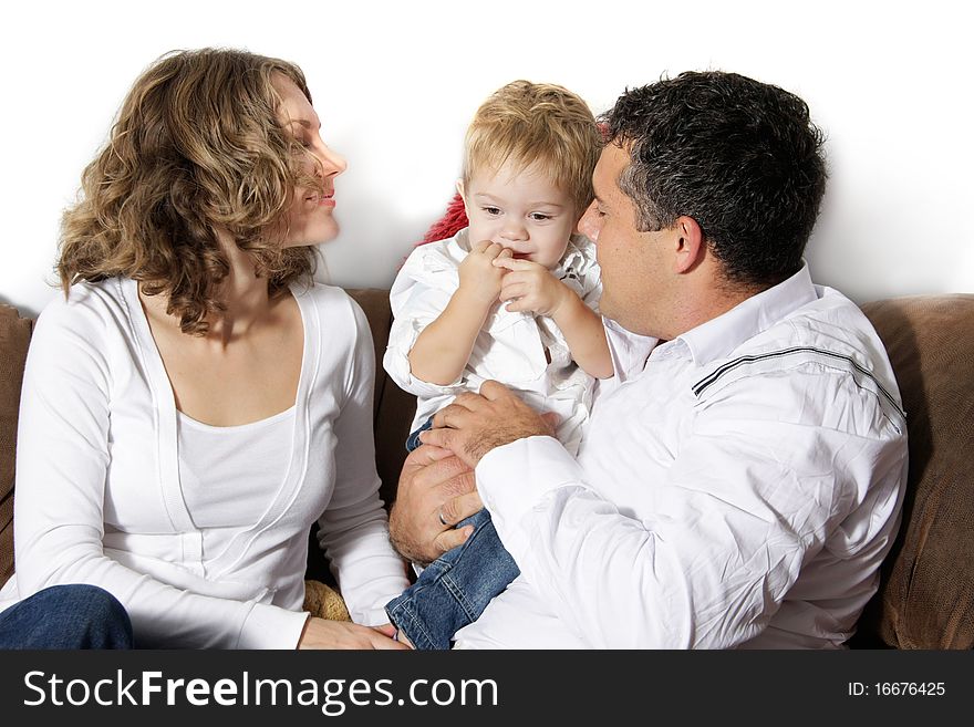 Young happy family at home over white