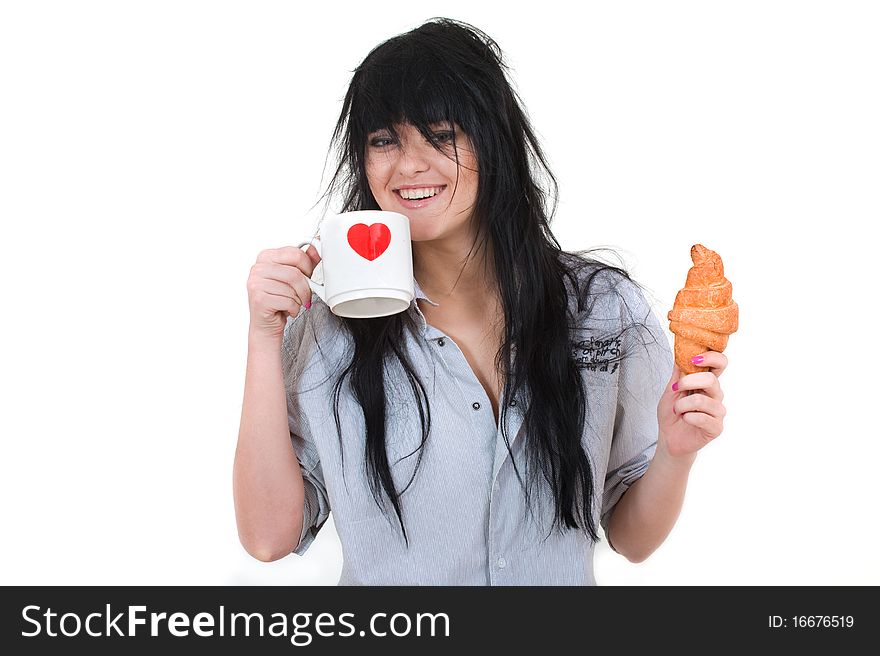 Cute girl with cup and croissant in shirt isolated on white