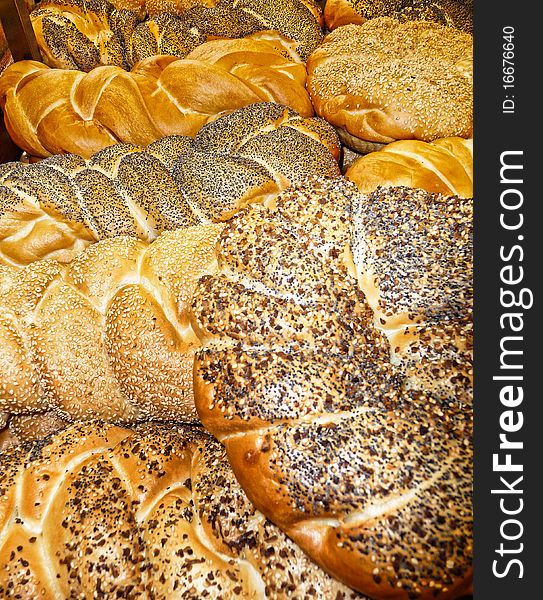 Assortment of fresh baked bread out of the oven in the bakery. Assortment of fresh baked bread out of the oven in the bakery