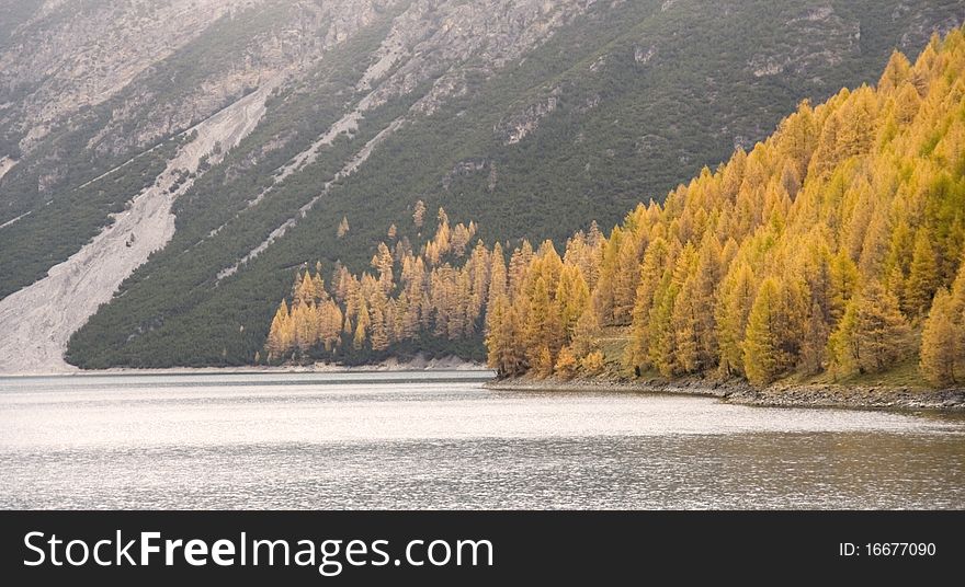 An autumn mountain lake panorama in Livigno, Valtellima, Italy