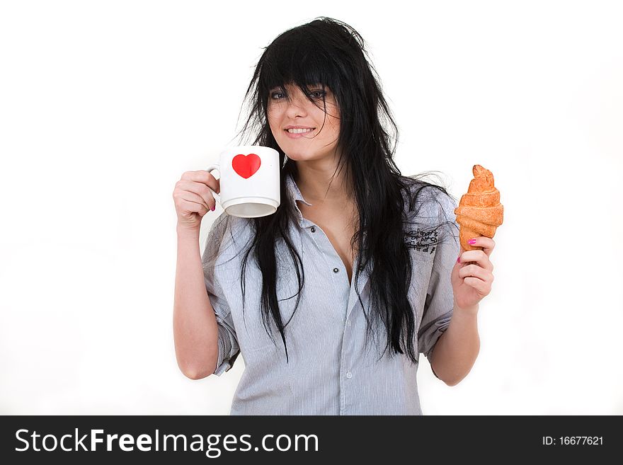 Cute girl with cup and croissant in shirt isolated on white
