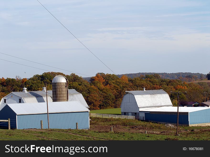 Modern New England farm in autumn with blue sky. Modern New England farm in autumn with blue sky.