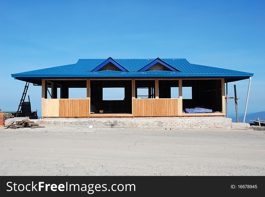 A house renovation with blue sky as background