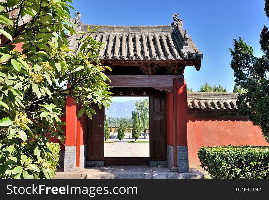 Door and court view of a Chinese old temple garden, shown as traditional architecture style and detail. Door and court view of a Chinese old temple garden, shown as traditional architecture style and detail.